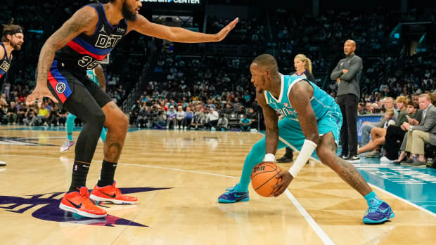 Detroit Pistons forward Marvin Bagley III defends Charlotte Hornets guard Terry Rozier.